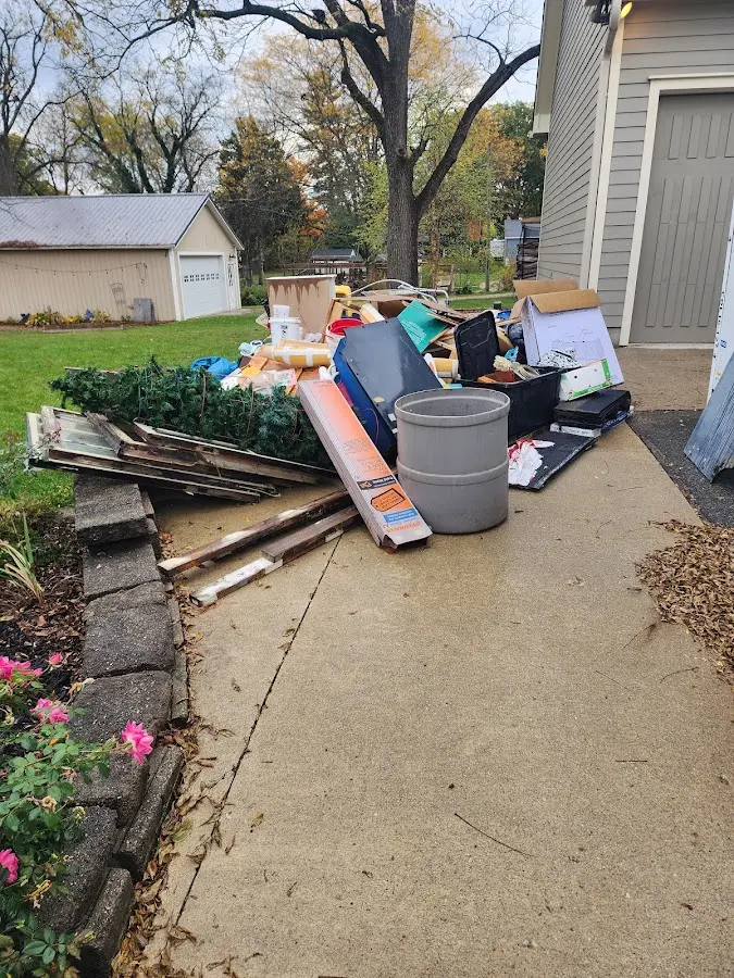 Dumpster being loaded with debris for Estate Cleanout Dumpster Rental in Homestead Meadows South